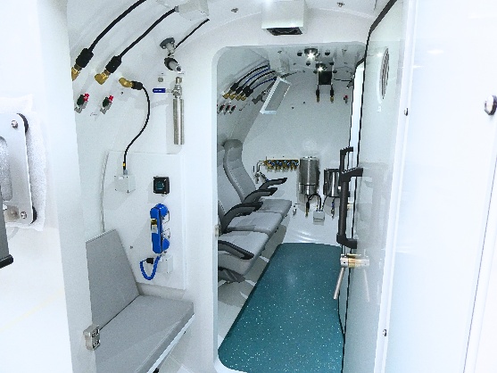 Interior seating and breathing equipment inside Draak’s decompression chamber